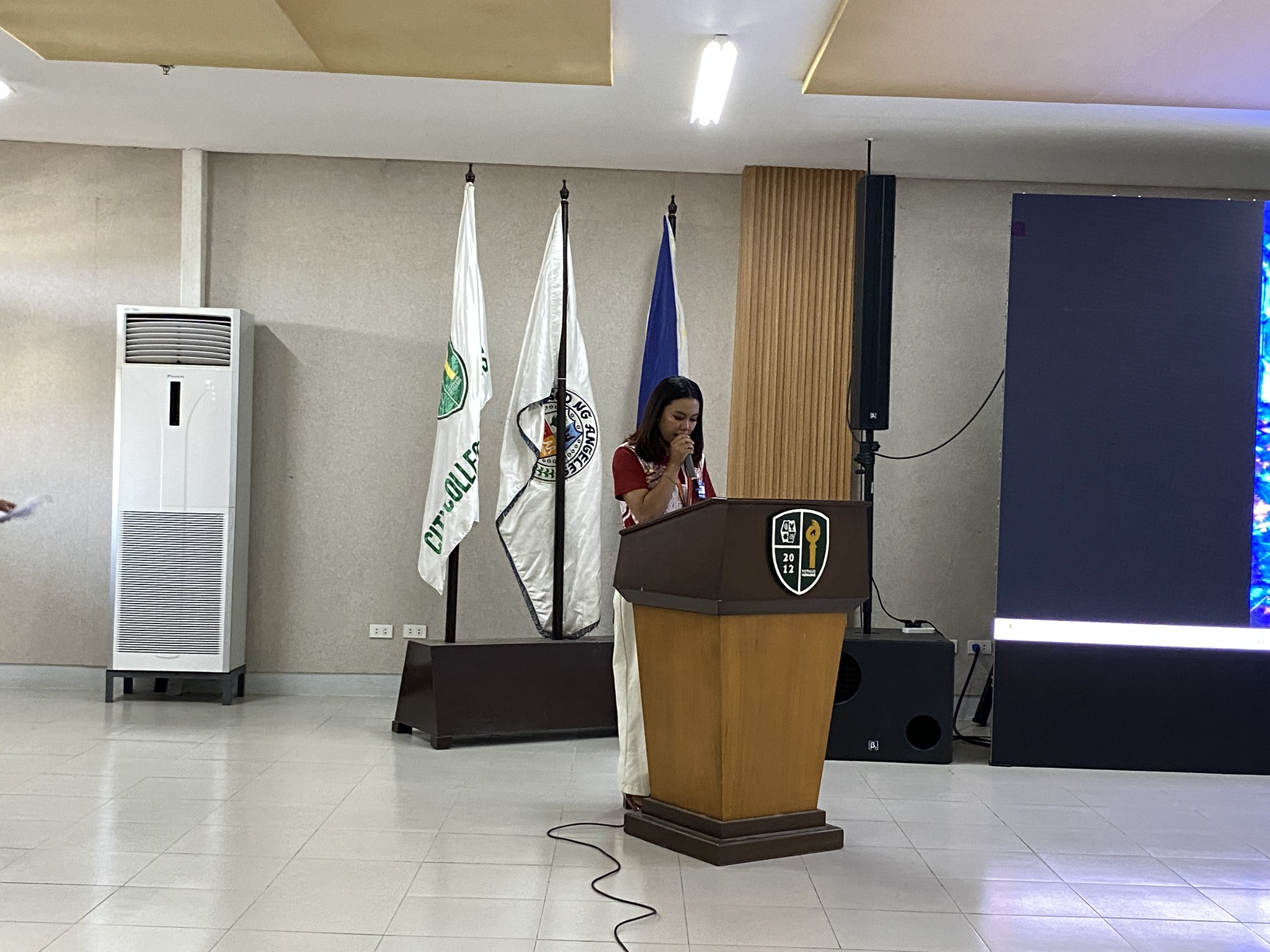 Seminar presenter at a podium